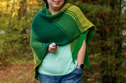 The Taryn Shawl Knitting Pattern by Lisa Clarke, Green version worn as a wrap
