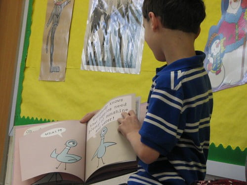 Son #1 reading to son #2's class