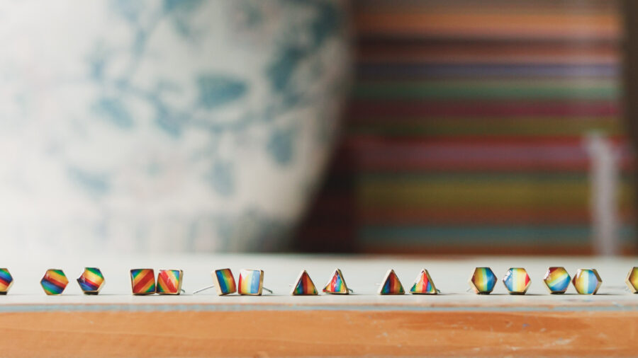A collection of rainbow stud earrings in various shapes