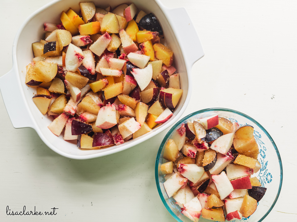 Peaches, plums, and sugar for Ginger Peach and Plum Crisp